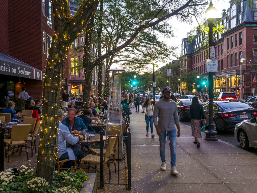Boston, MA, USA - June 20, 2018: The architecture of Boston in Massachusetts, USA at night showcasing the iconic Newbury Street and its stores and restaurants..