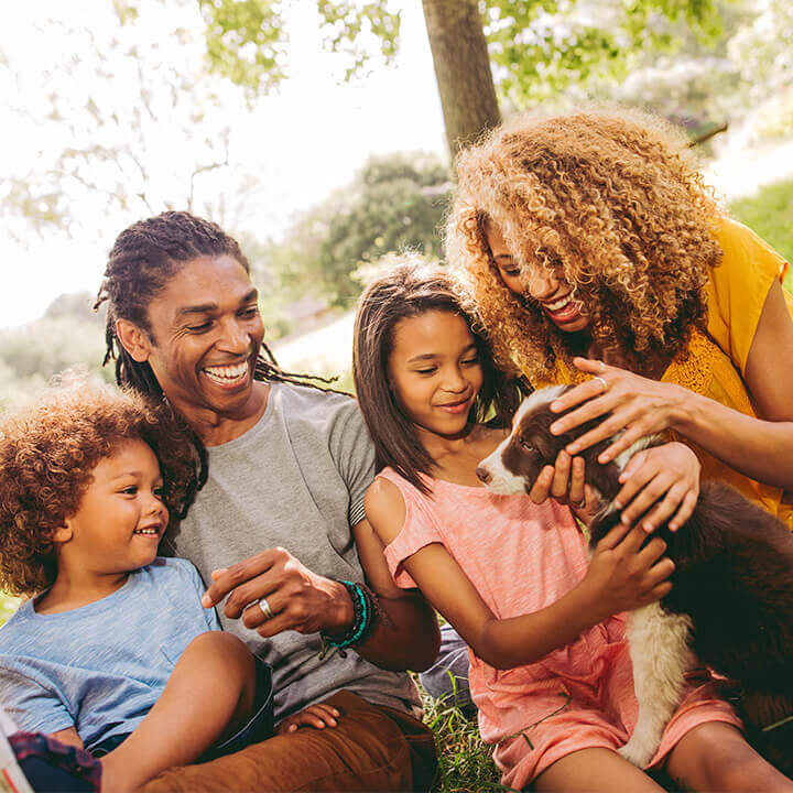 a family enjoying time in their backyard free of pests